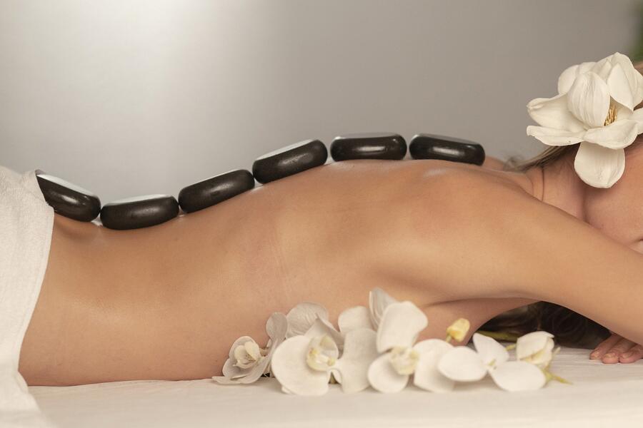 Therapist's hands working on a client's back during a massage